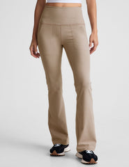 brown high-waisted bootcut pants with side pockets.
