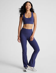 blue high-waisted bootcut pant with pockets.