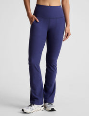 blue high-waisted bootcut pant with pockets.