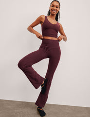 red high-waisted bootcut pants with pockets.