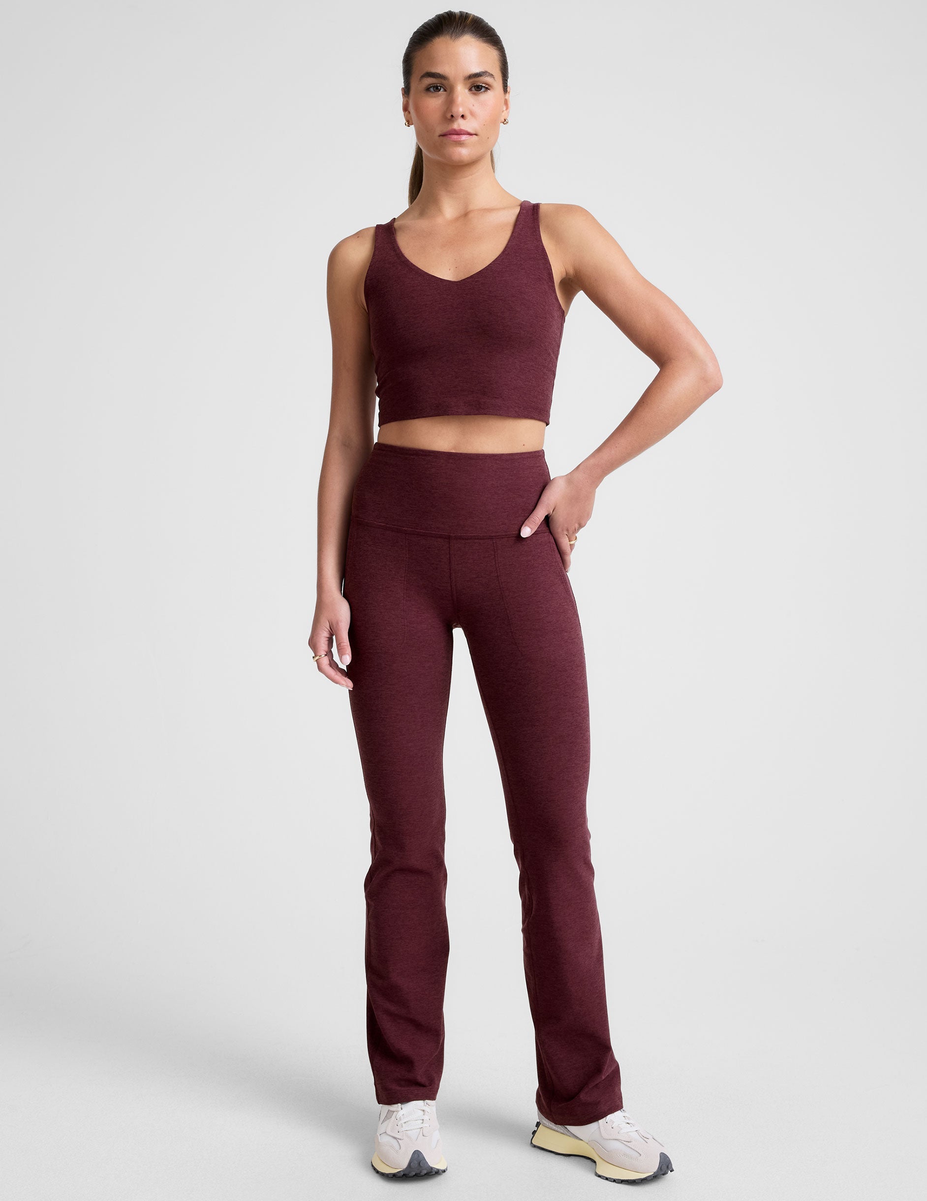 red high-waisted bootcut pants with pockets.