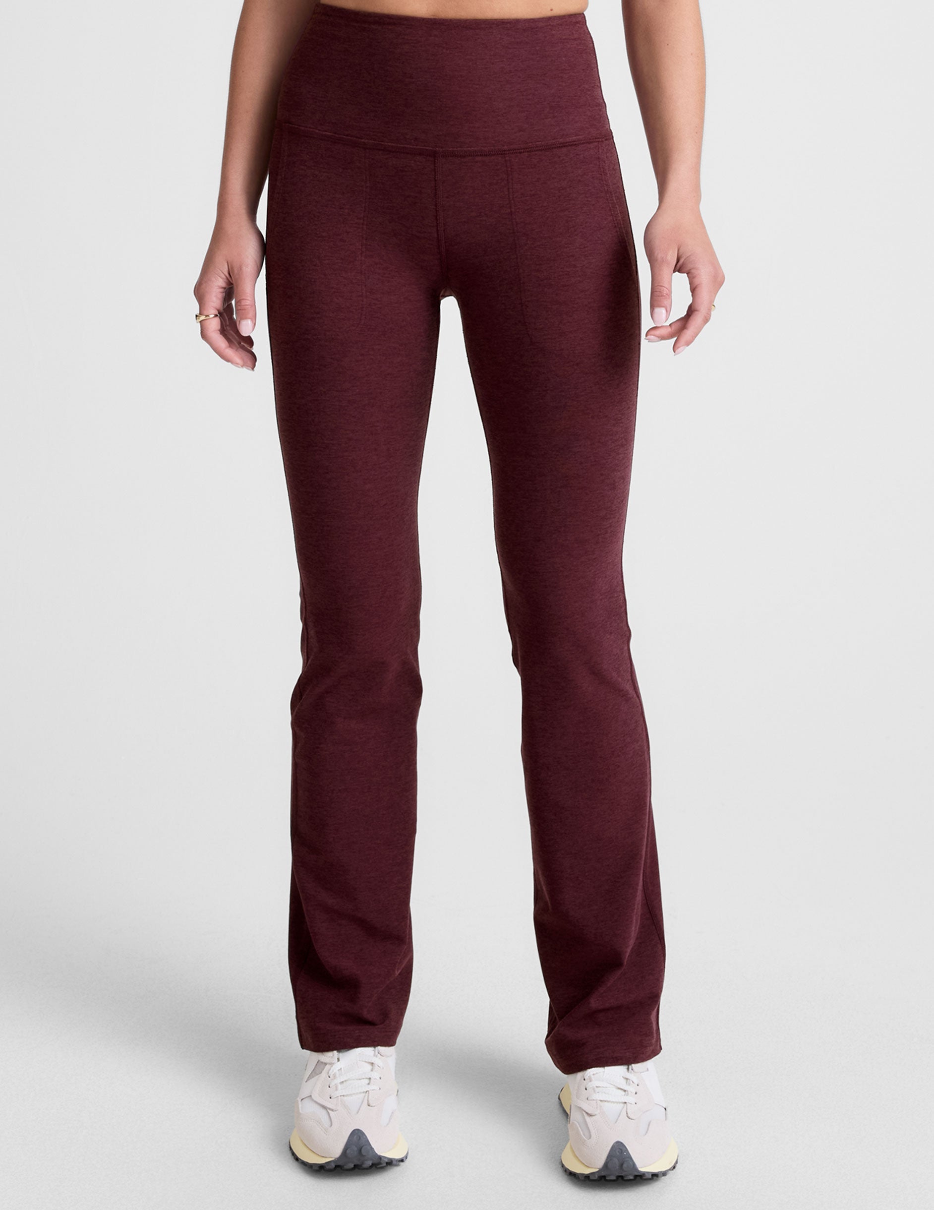 red high-waisted bootcut pants with pockets.