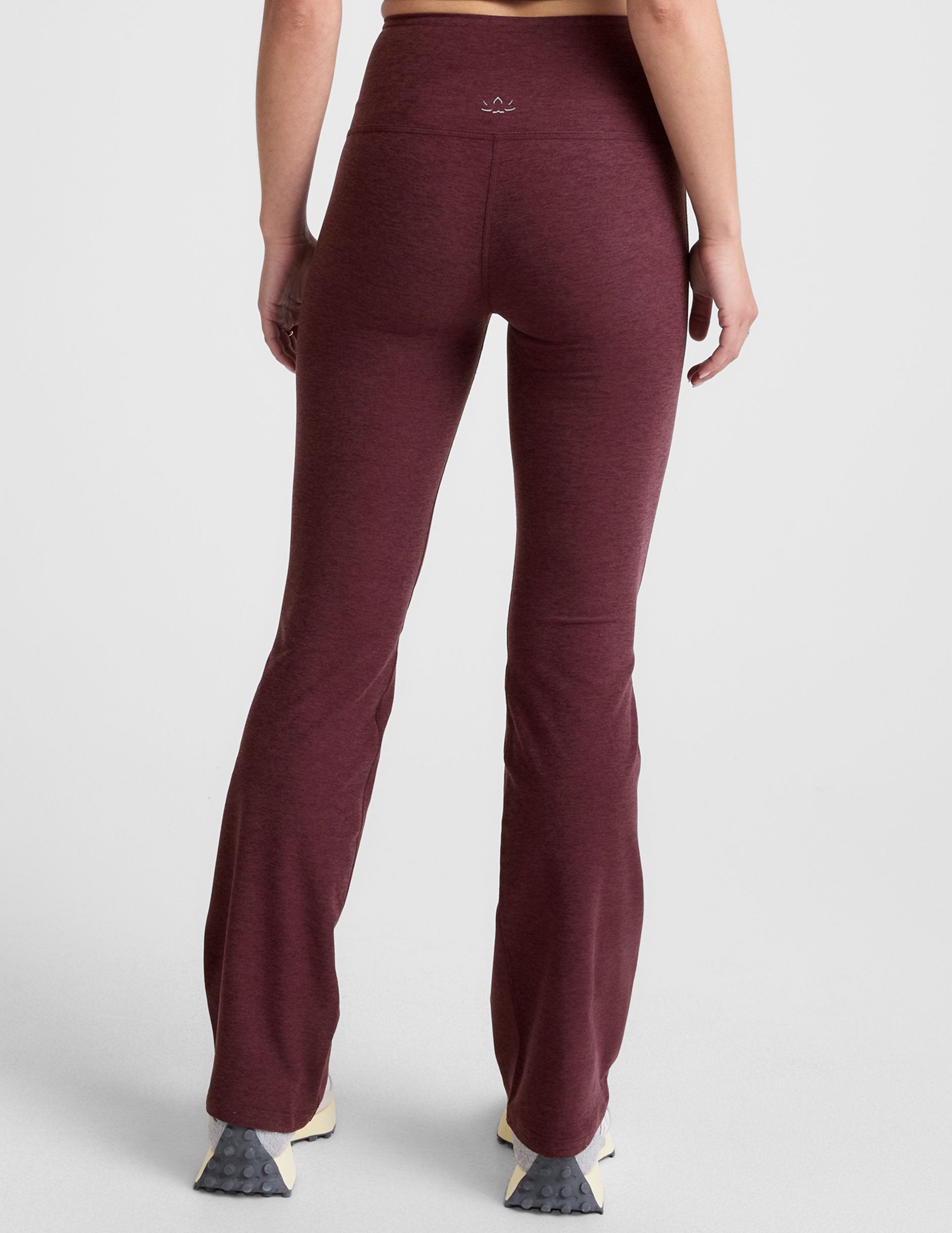 red high-waisted bootcut pants with pockets.
