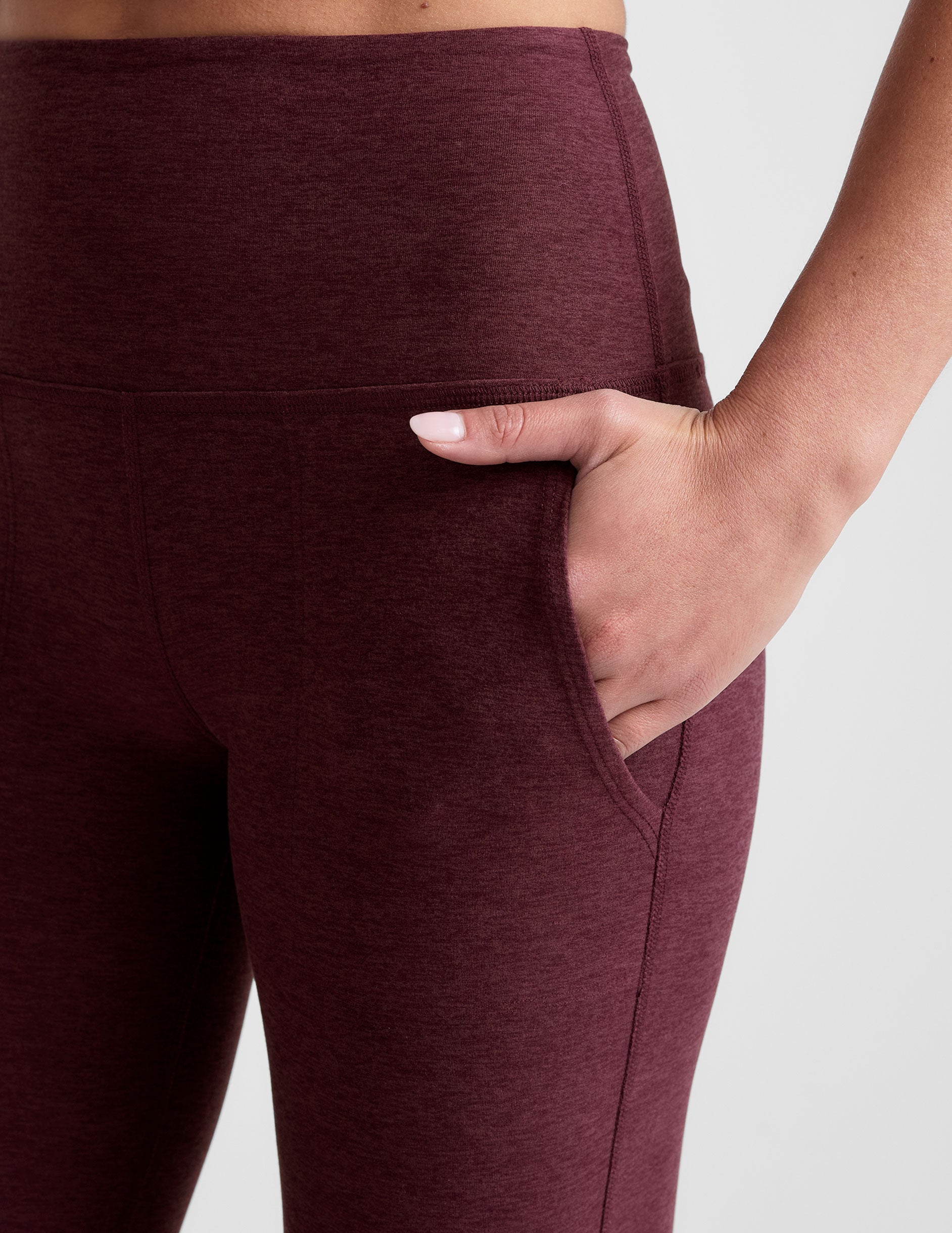 red high-waisted bootcut pants with pockets.