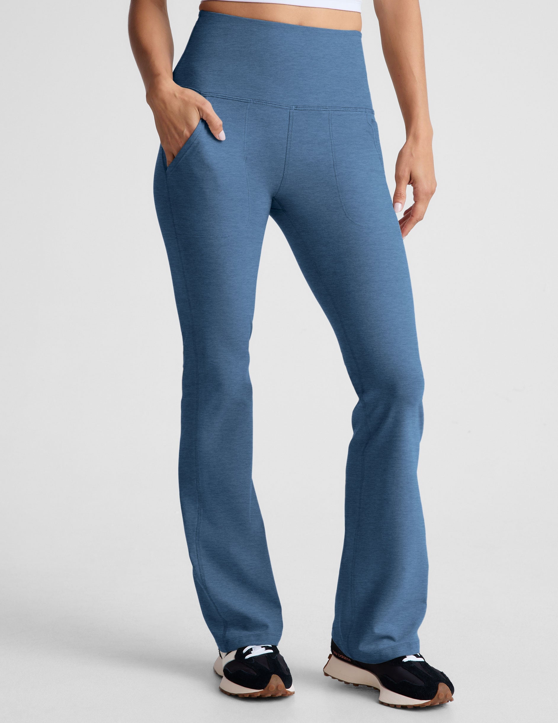 blue high-waisted bootcut pants with pockets.