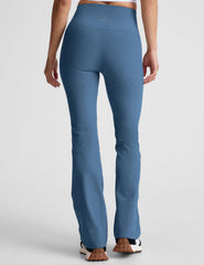 blue high-waisted bootcut pants with pockets.