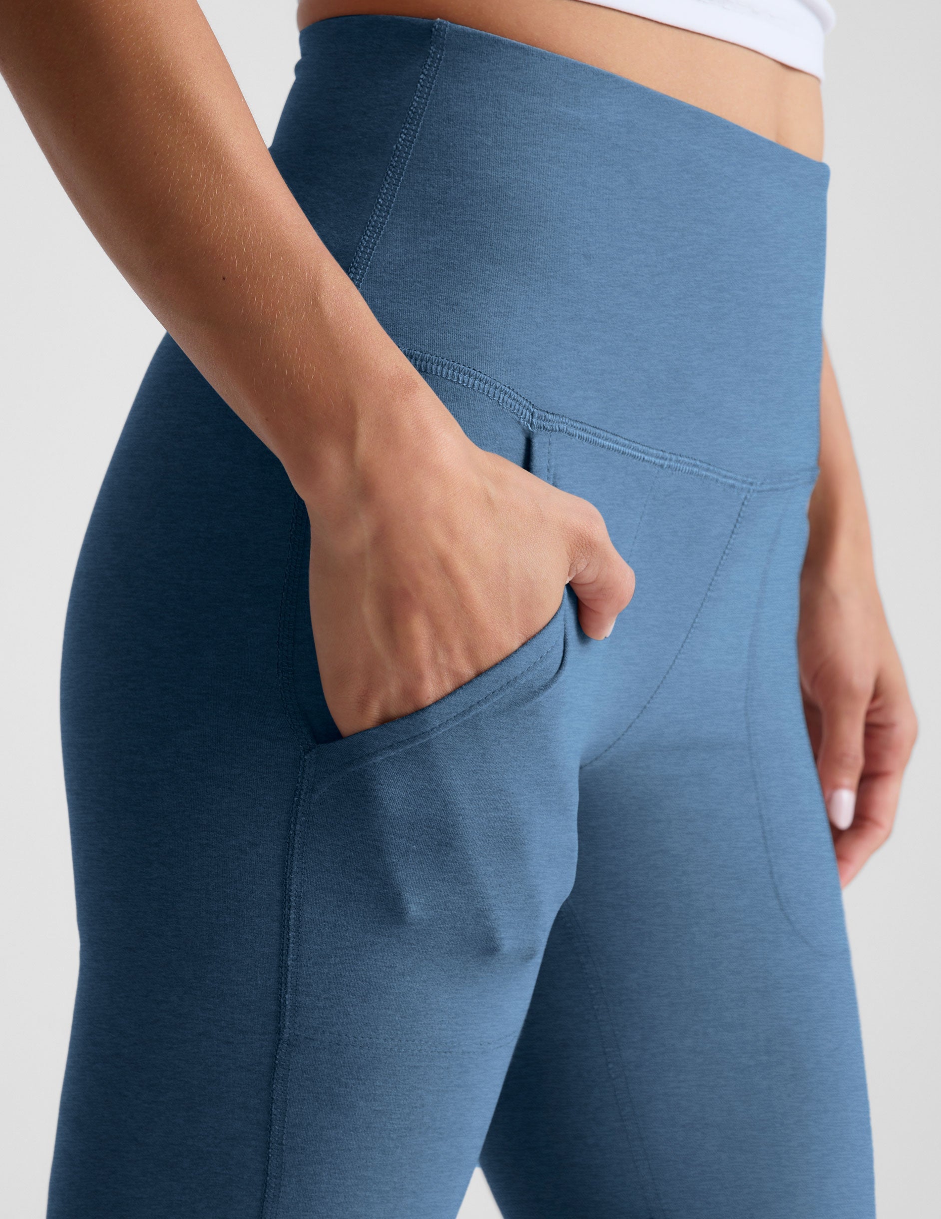 blue high-waisted bootcut pants with pockets.