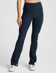 blue high-waisted bootcut pants with white contrast trim on the sides.