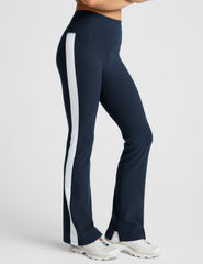 blue high-waisted bootcut pants with white contrast trim on the sides.