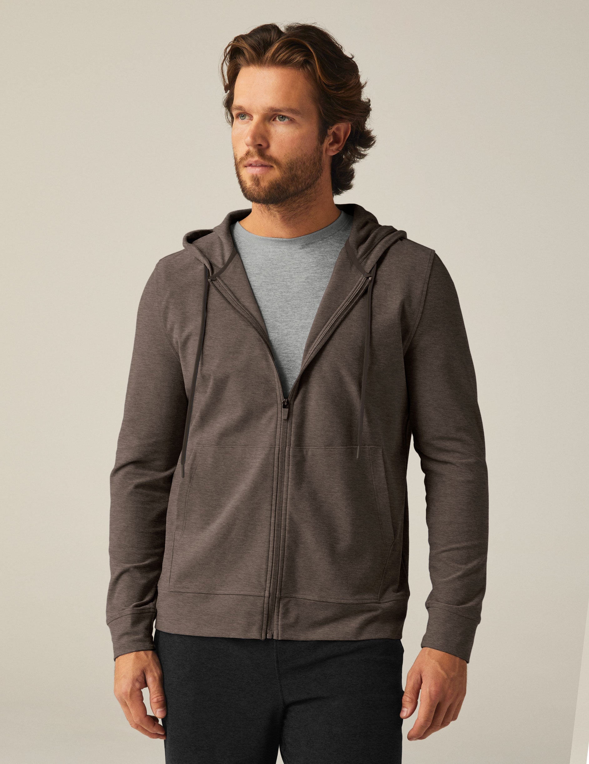 brown men's zip-up jacket with a hood and pockets.