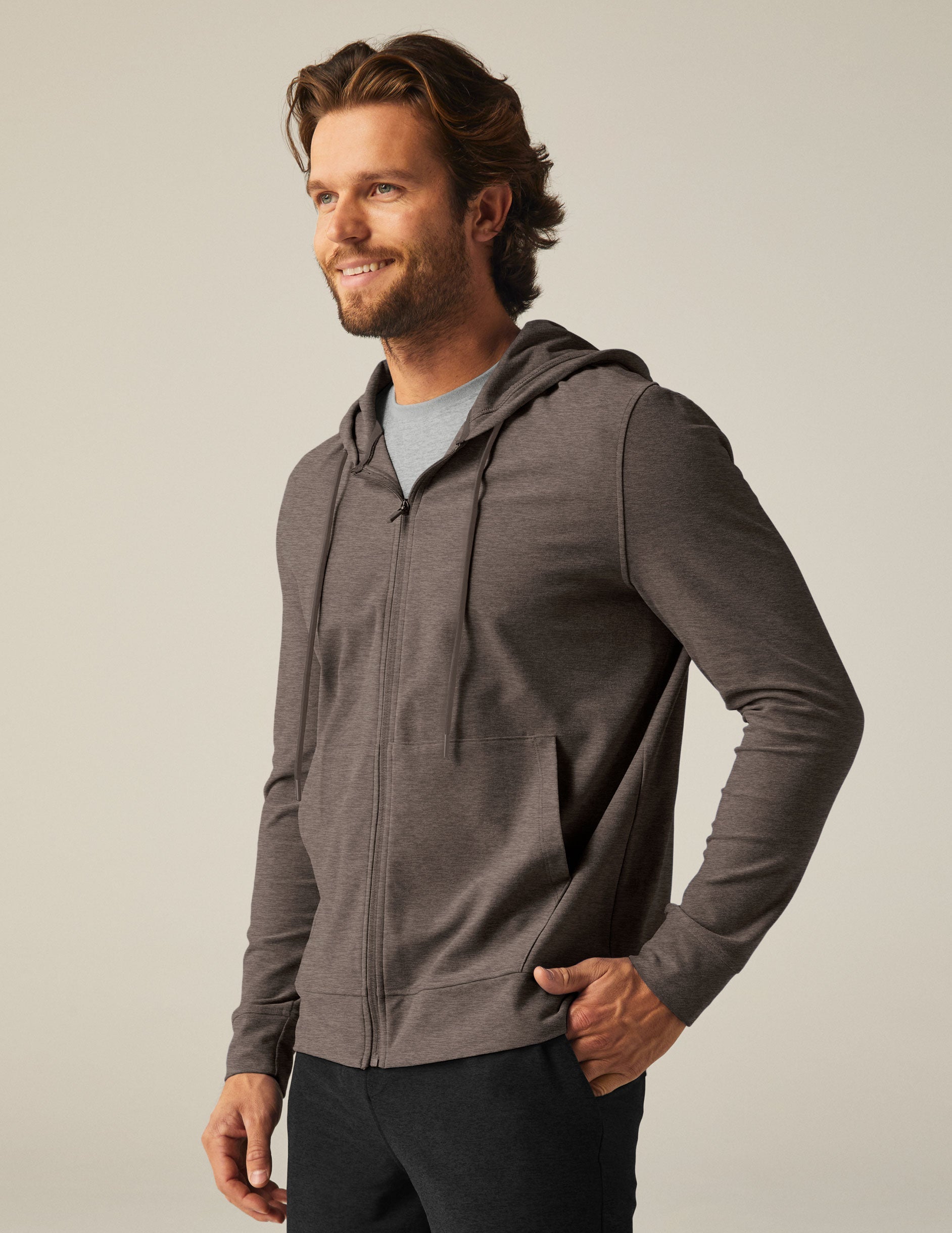 brown men's zip-up jacket with a hood and pockets.