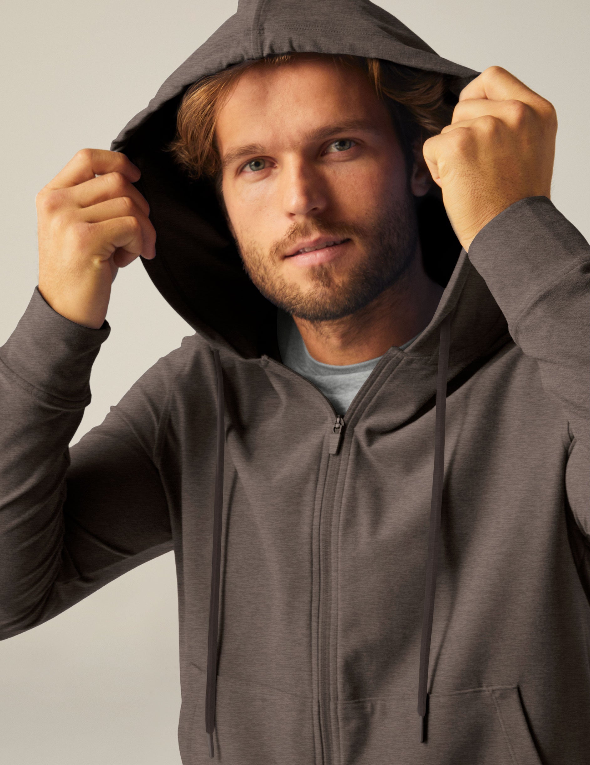 brown men's zip-up jacket with a hood and pockets.