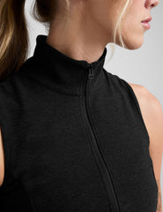black zip-up vest with a mesh upper back detail.