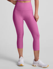 pink high-waisted capri length leggings.