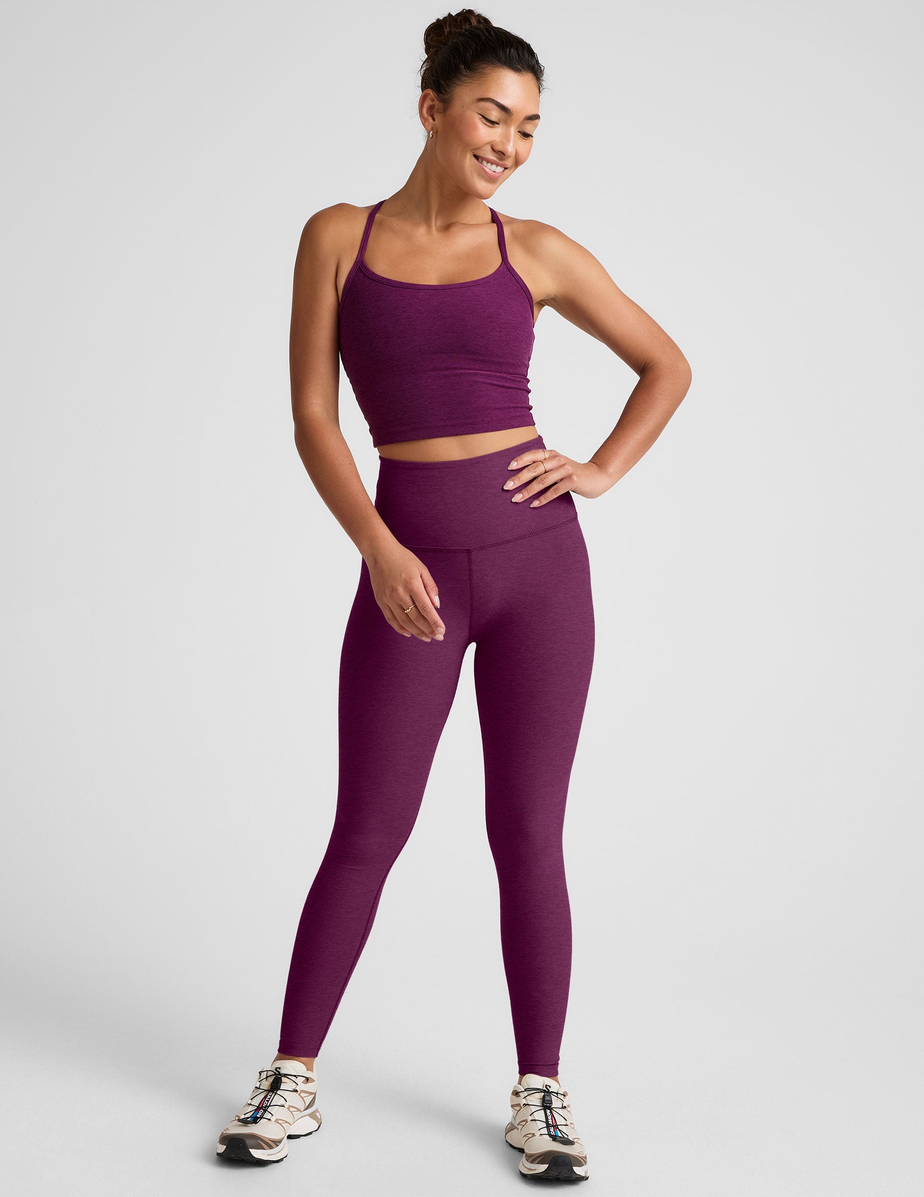 purple high-waisted midi length leggings.