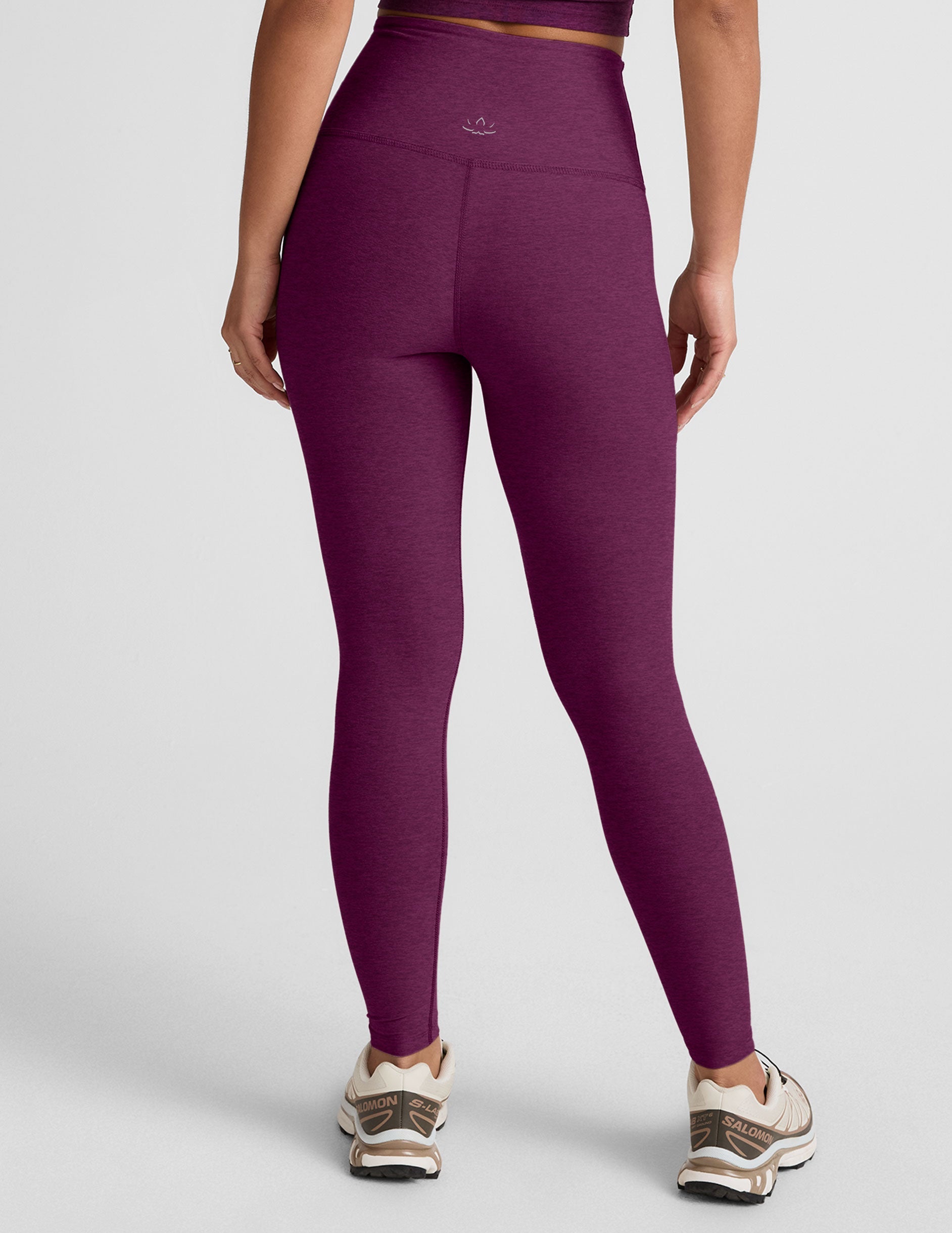 purple high-waisted midi length leggings.