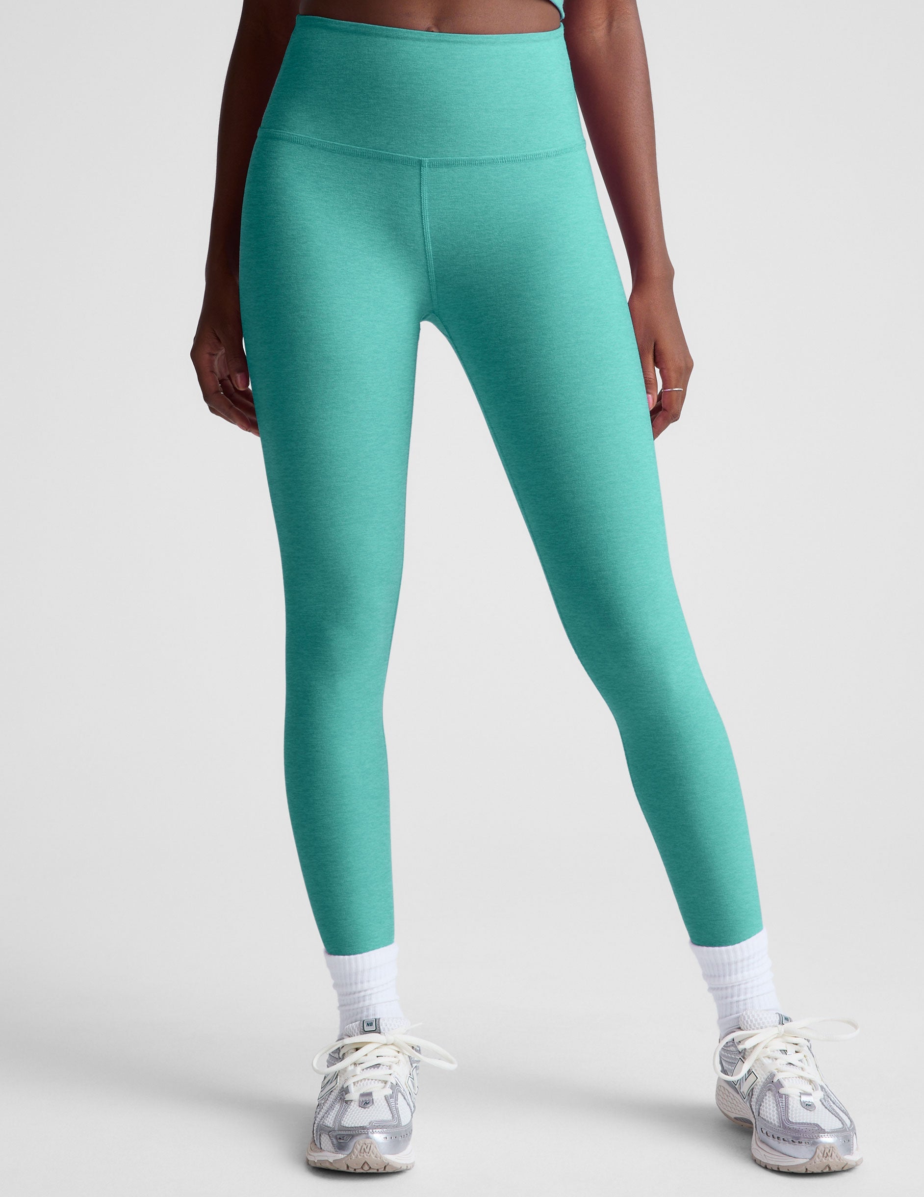blue high-waisted midi length leggings.