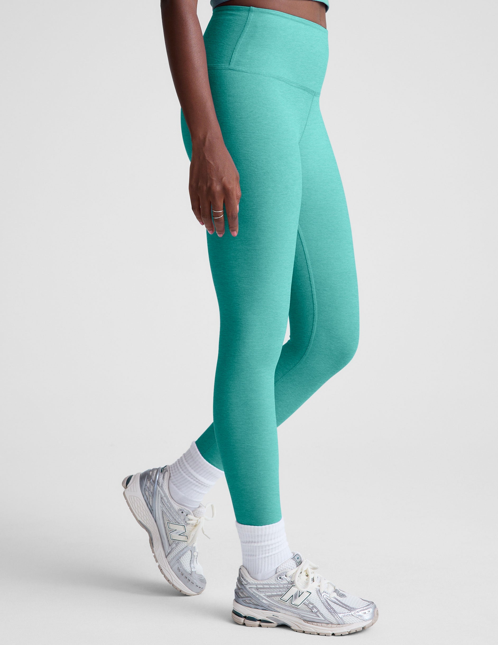 blue high-waisted midi length leggings.