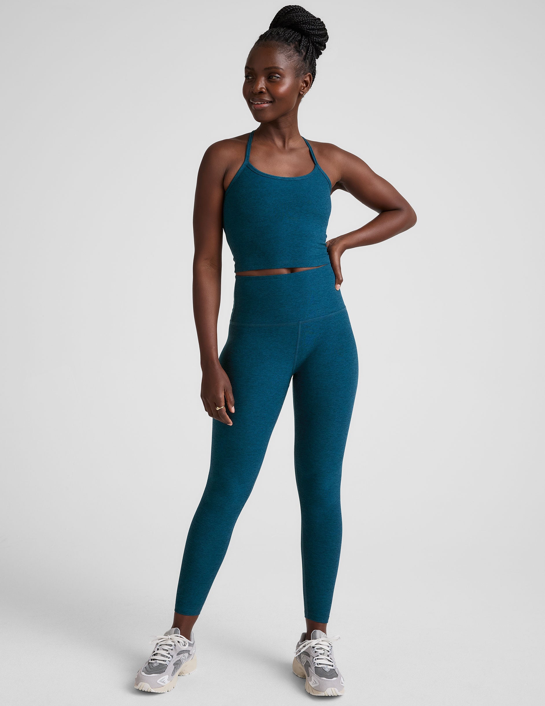blue high-waisted midi length leggings.