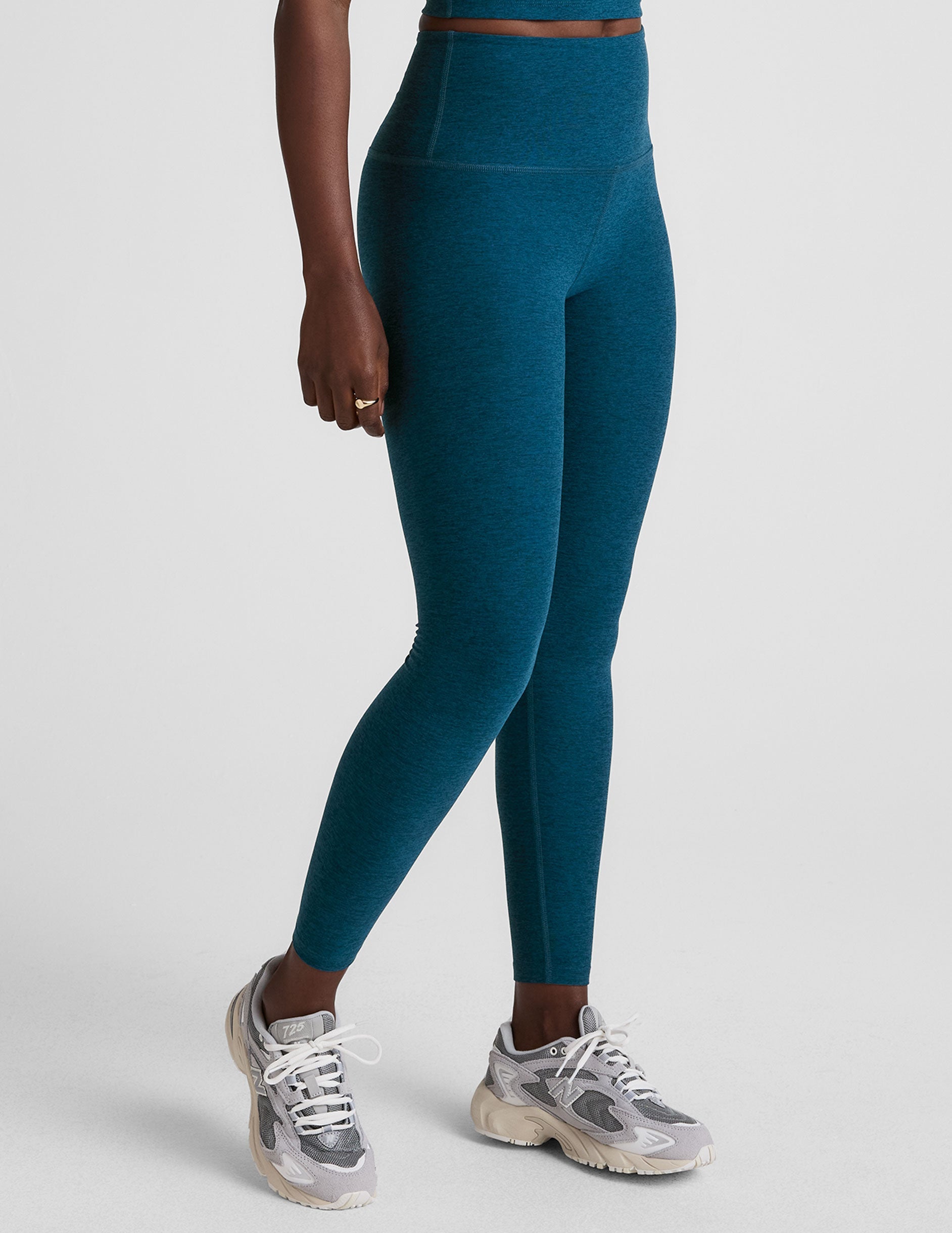 blue high-waisted midi length leggings.