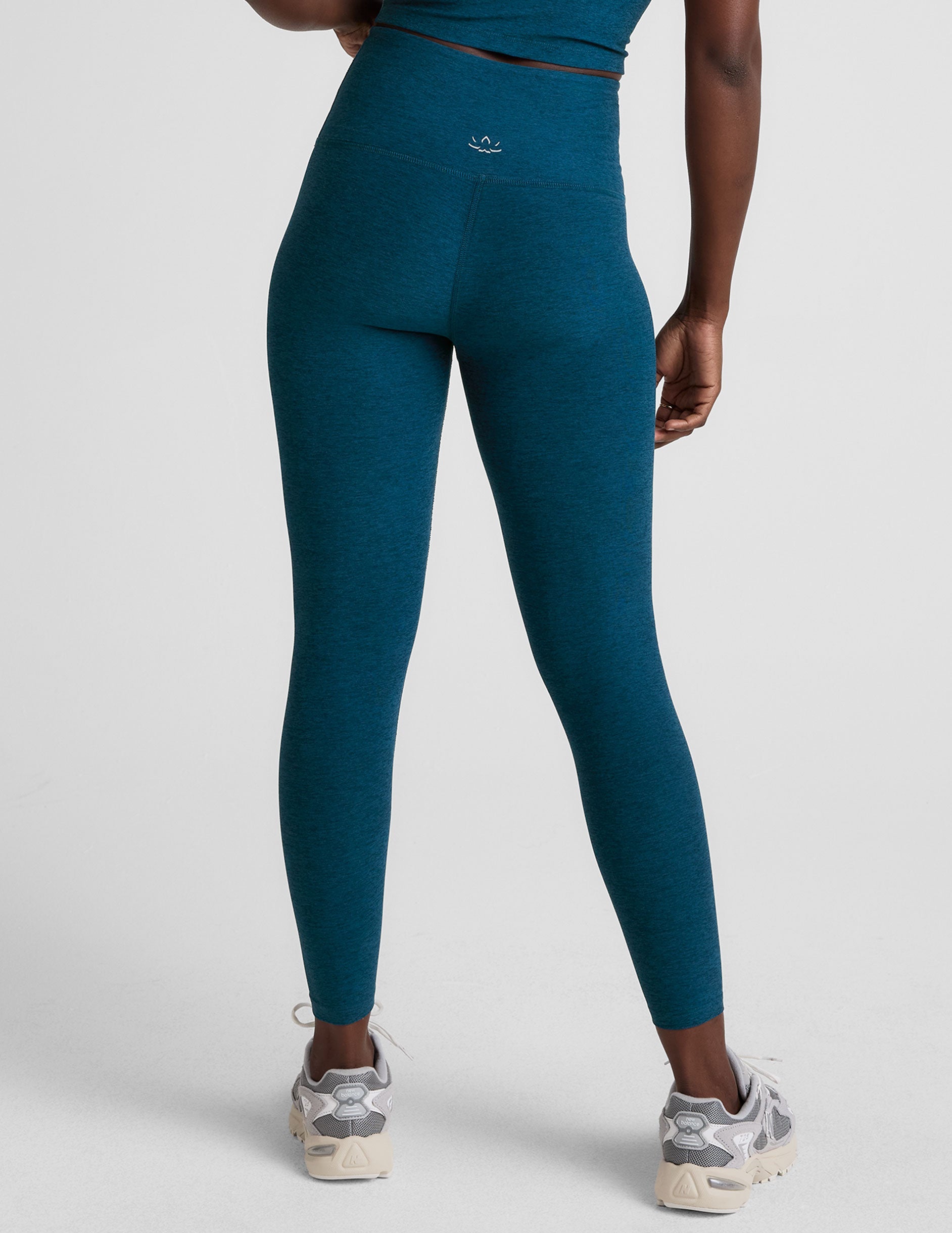 blue high-waisted midi length leggings.