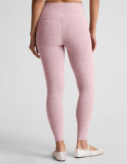 pink high-waisted midi length leggings.