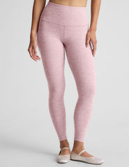 pink high-waisted midi length leggings.