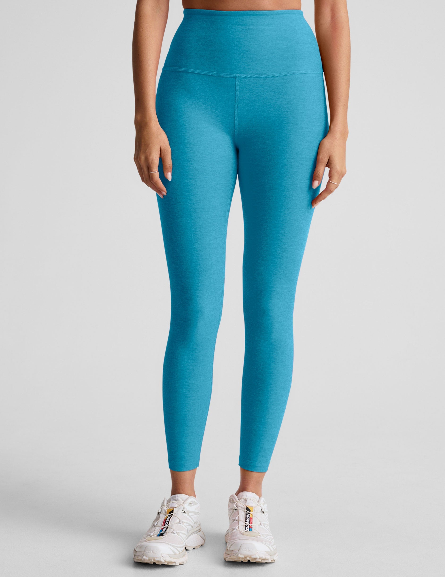 blue high-waisted midi length leggings.