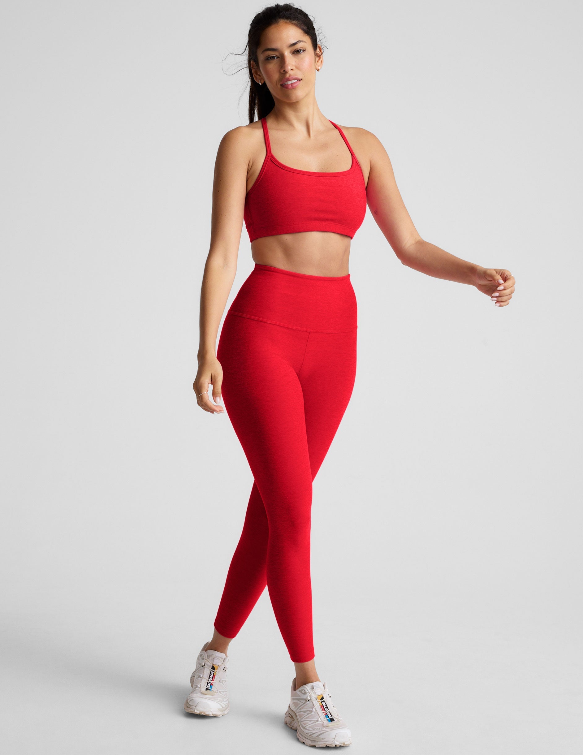 red high-waisted midi length leggings.