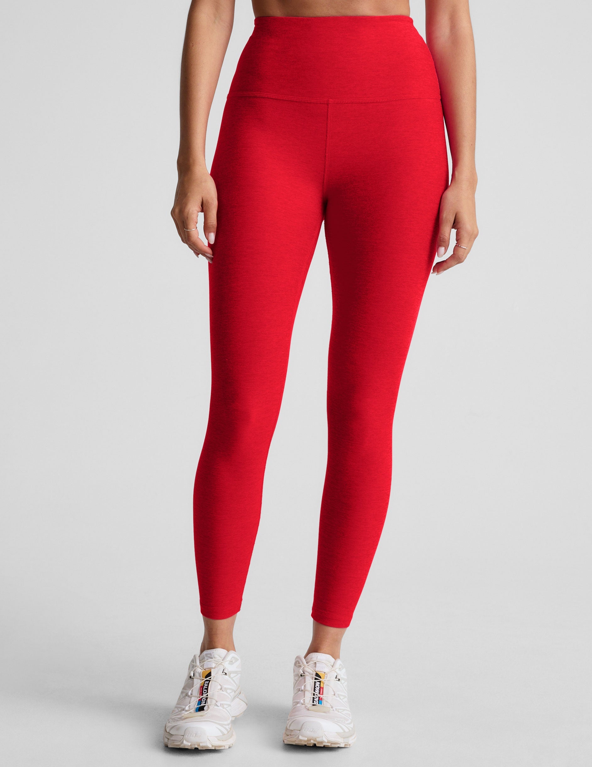 red high-waisted midi length leggings.