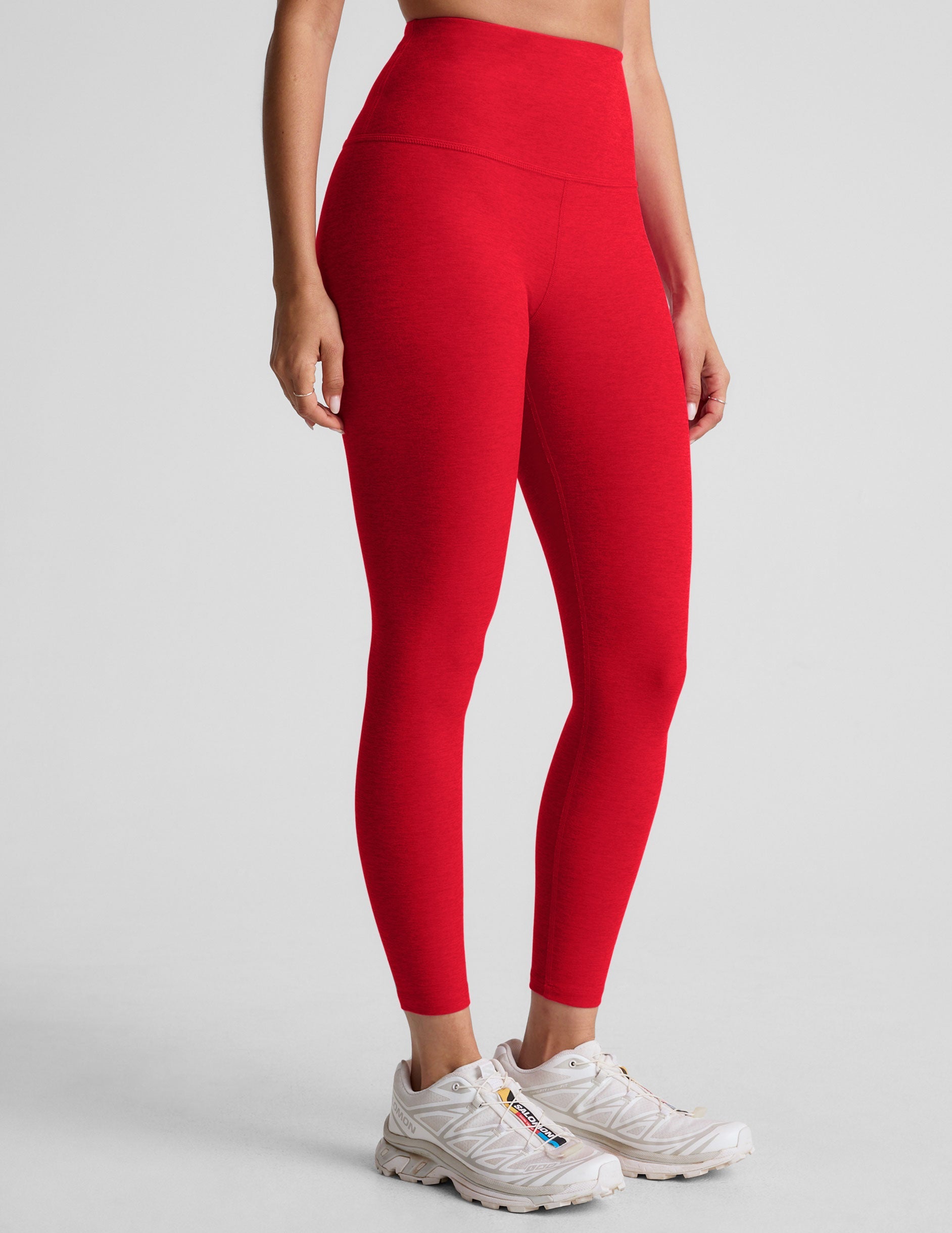 red high-waisted midi length leggings.