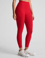 red high-waisted midi length leggings.