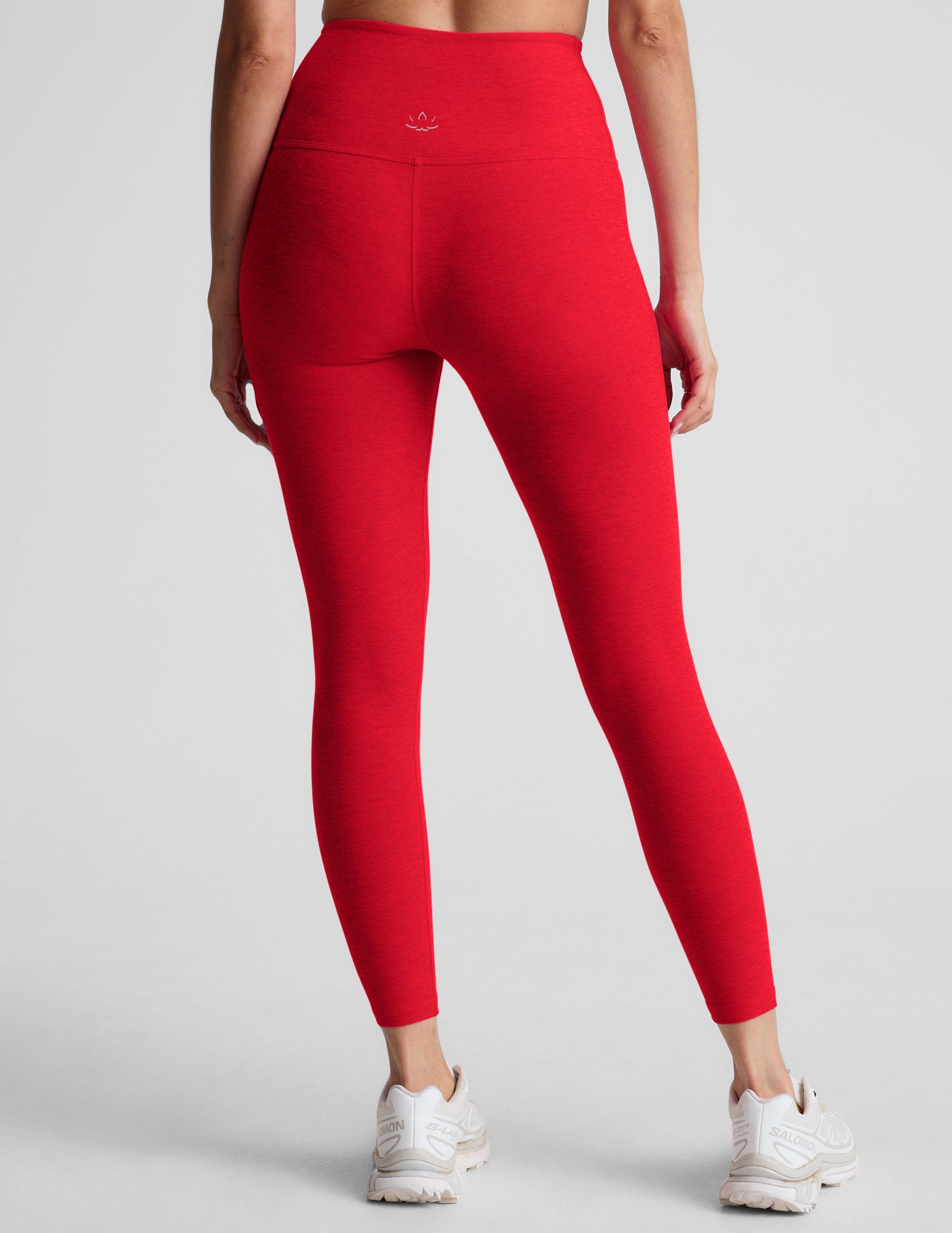 red high-waisted midi length leggings.