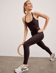 brown high-waisted midi length leggings.