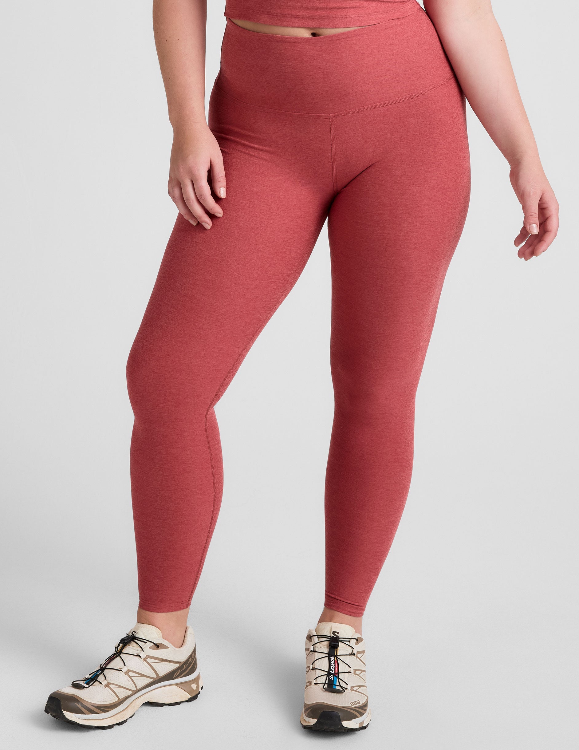 red high-waisted midi length leggings.