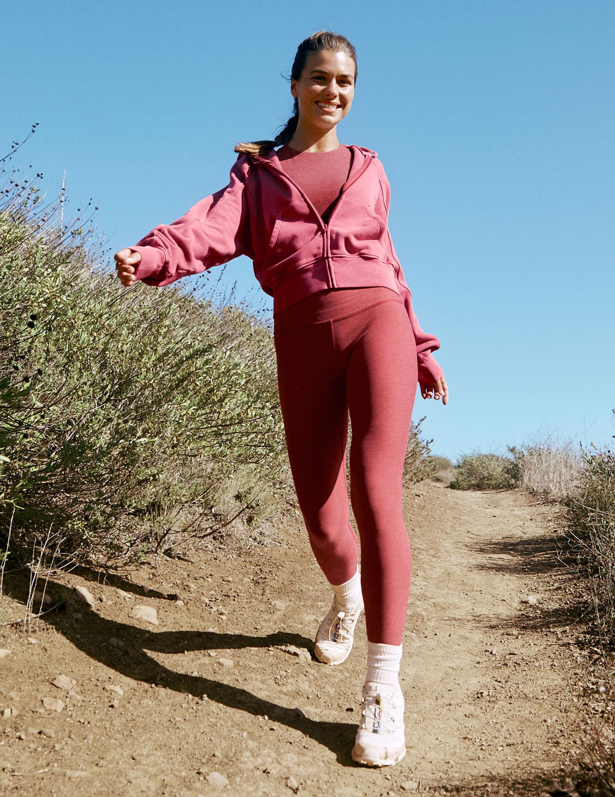red high-waisted midi length leggings.
