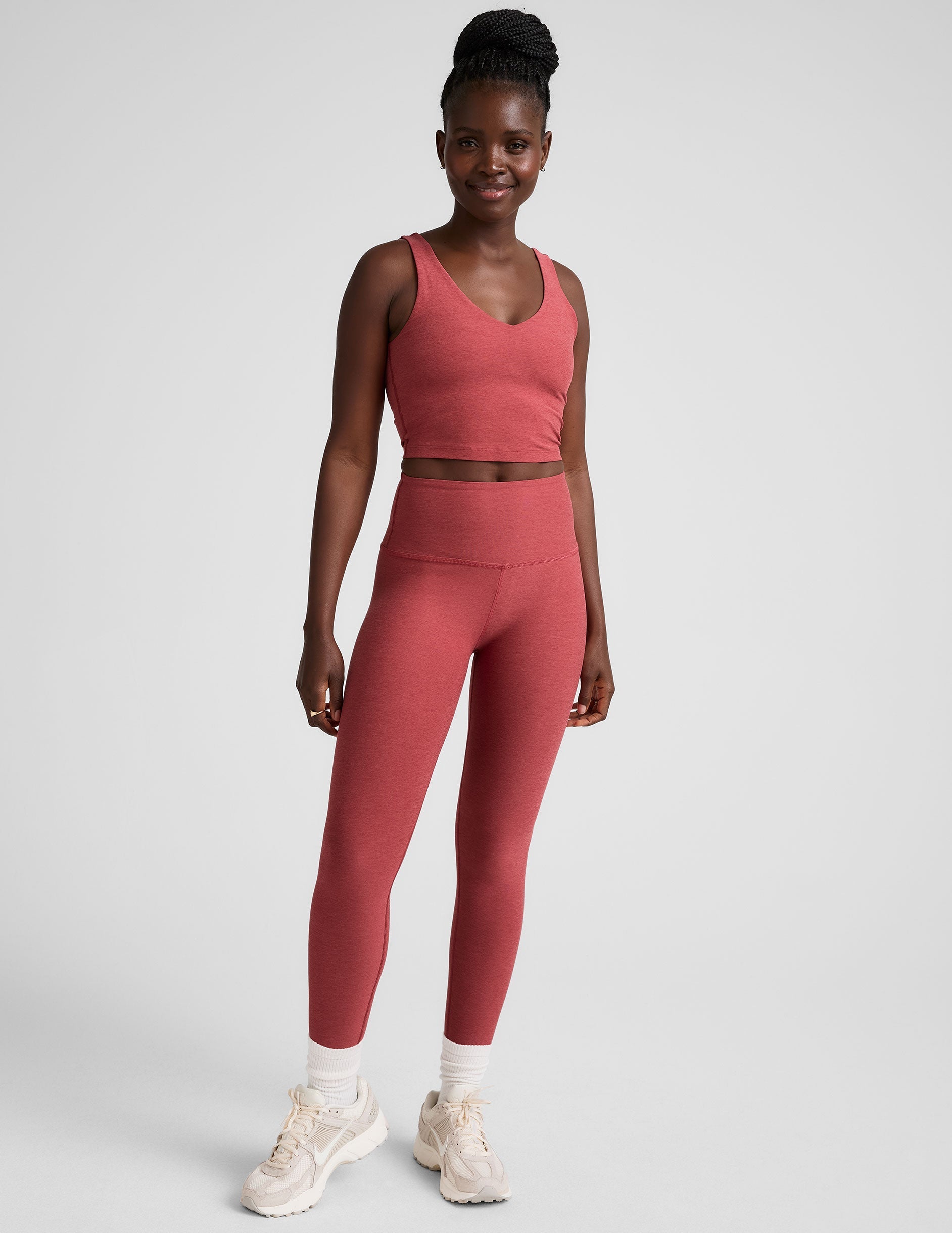 red high-waisted midi length leggings.