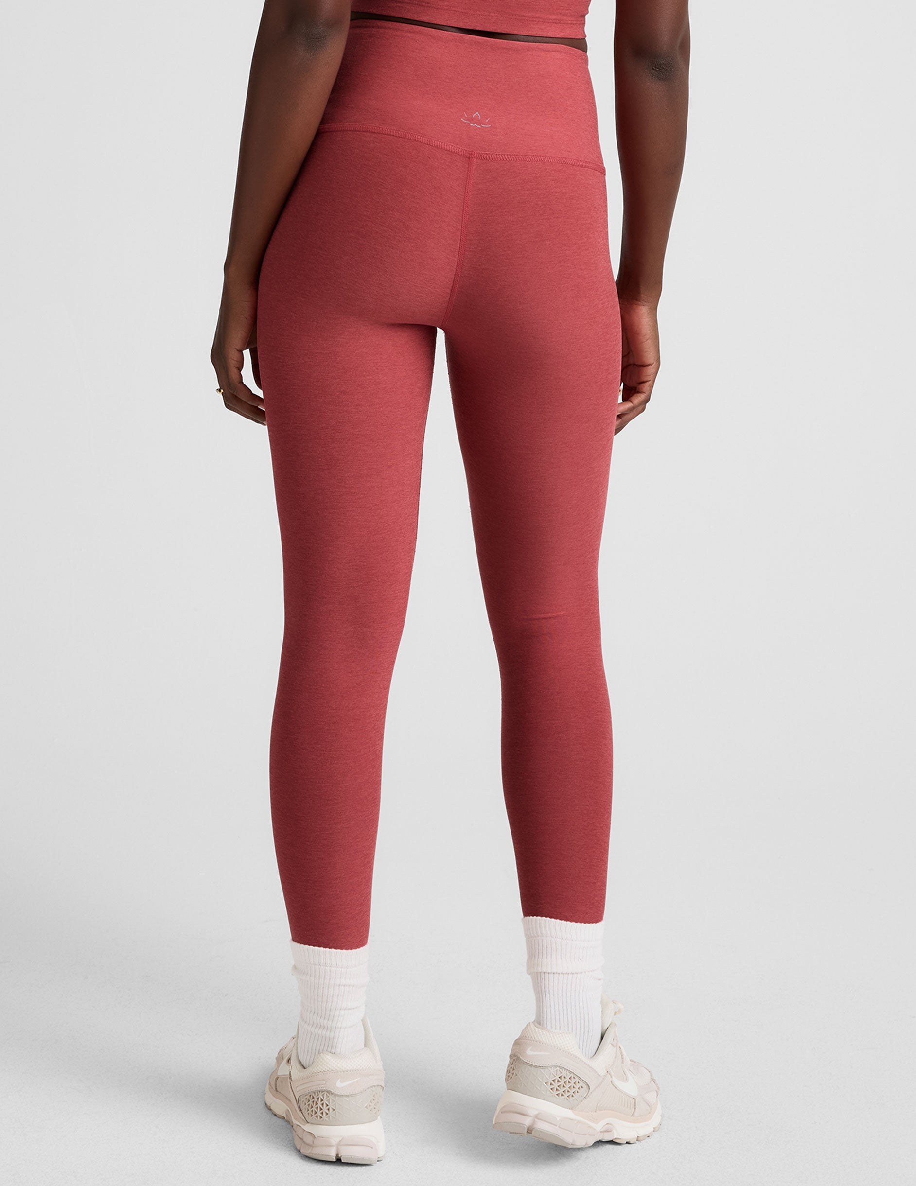 red high-waisted midi length leggings.