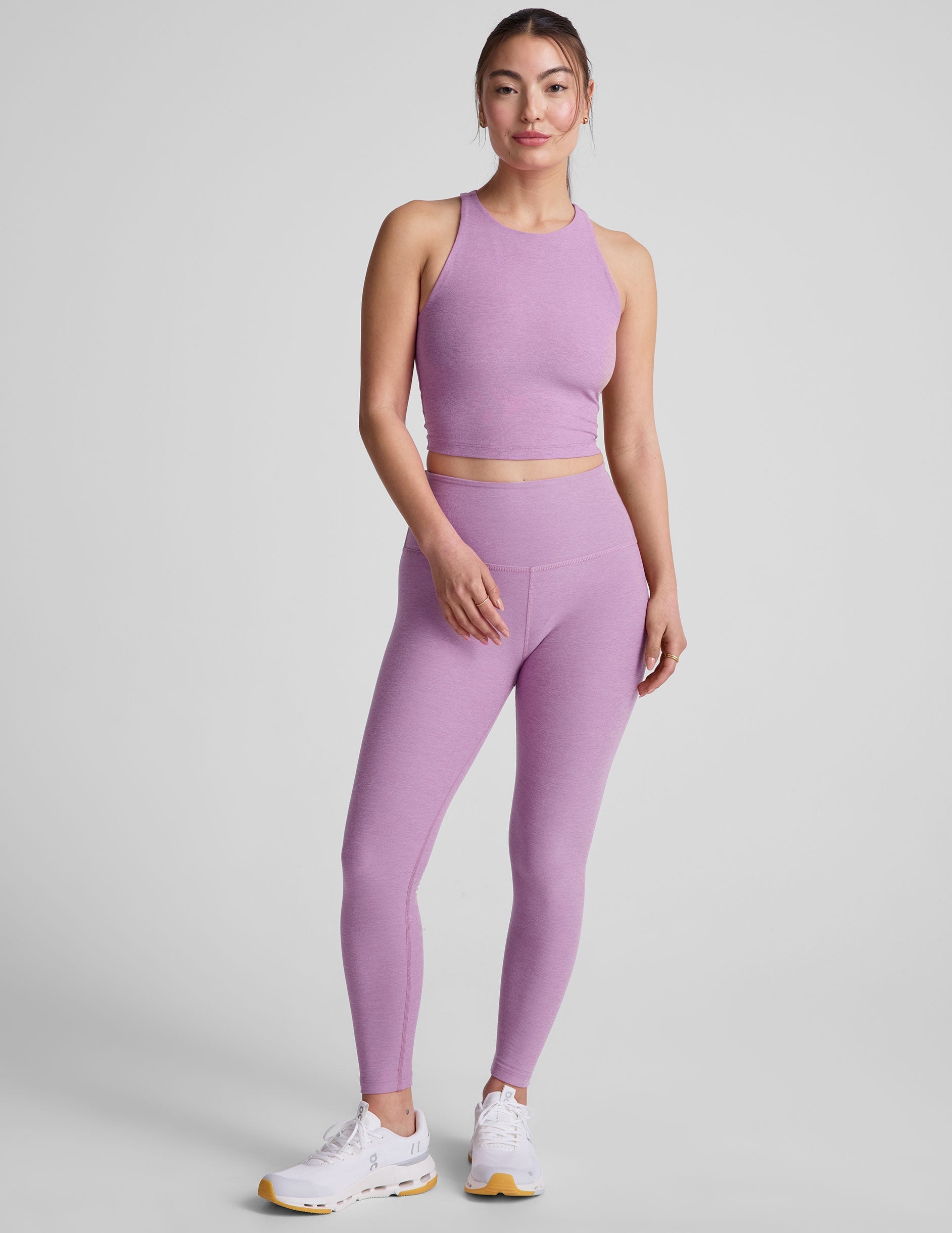 purple high-waisted midi length legging.