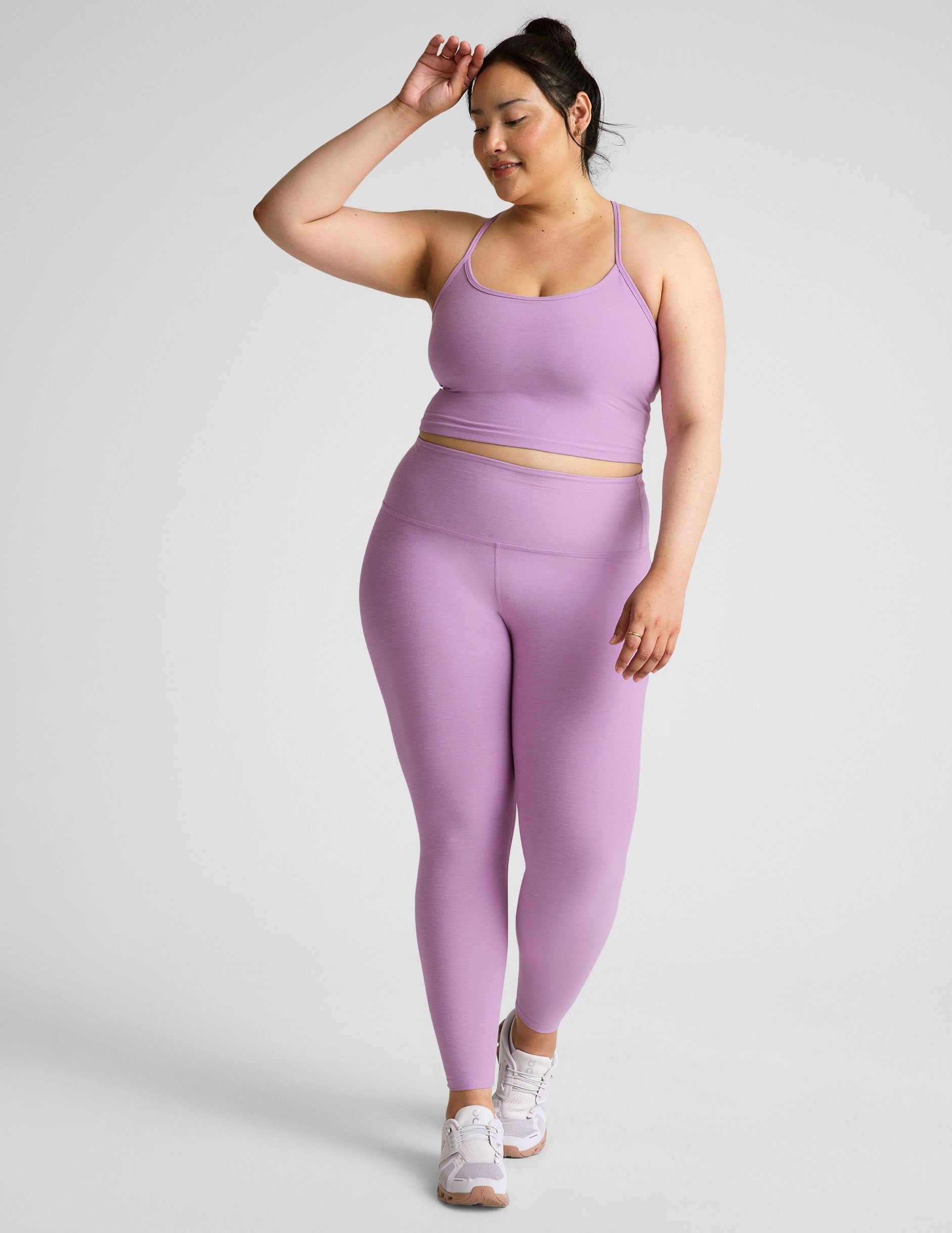 purple high-waisted midi length legging.