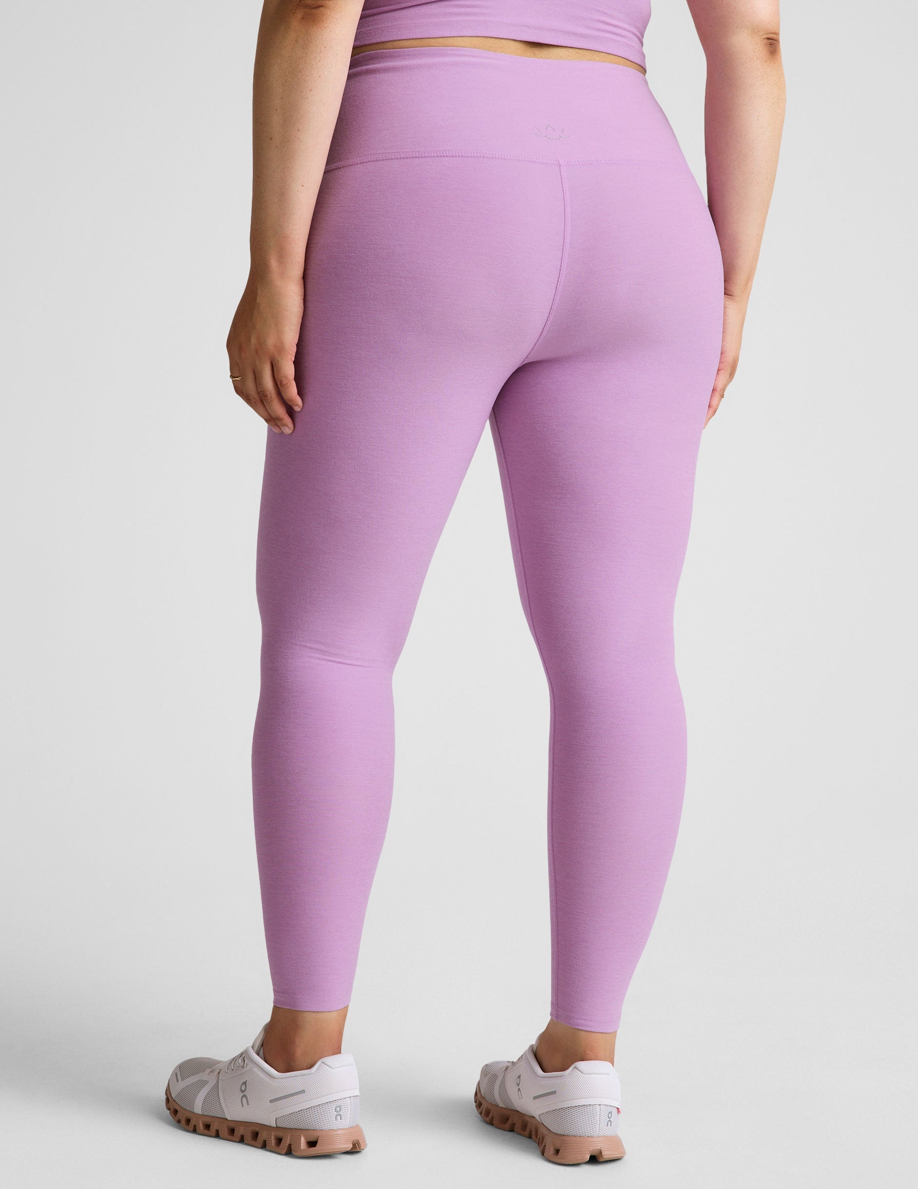purple high-waisted midi length legging.