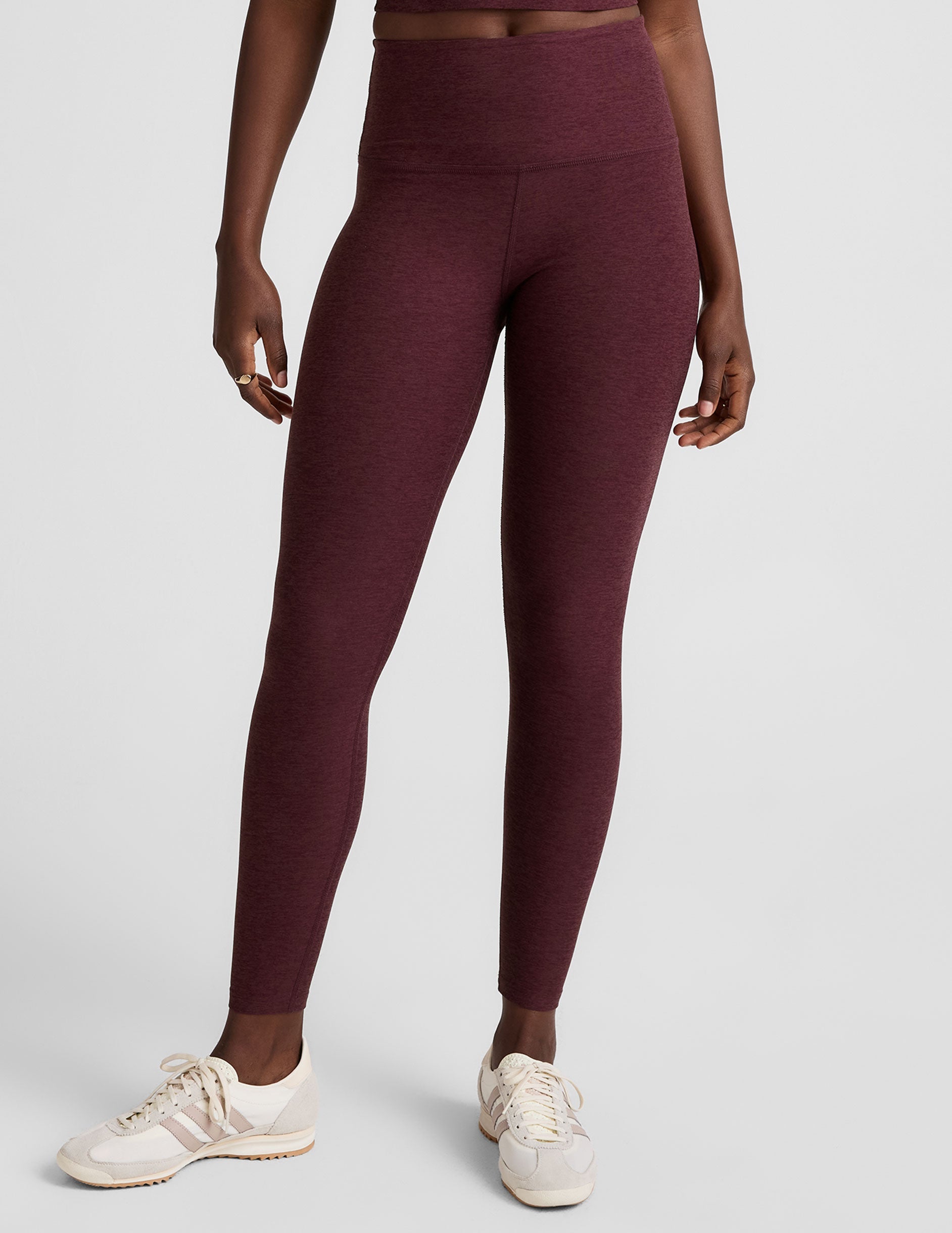 red high-waisted midi length leggings.