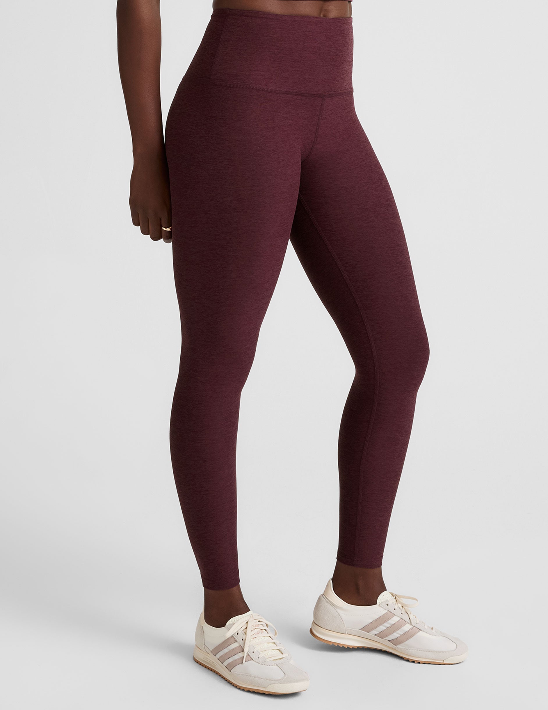 red high-waisted midi length leggings.