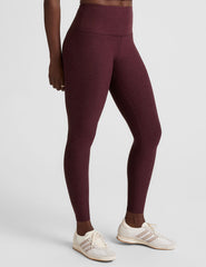 red high-waisted midi length leggings.