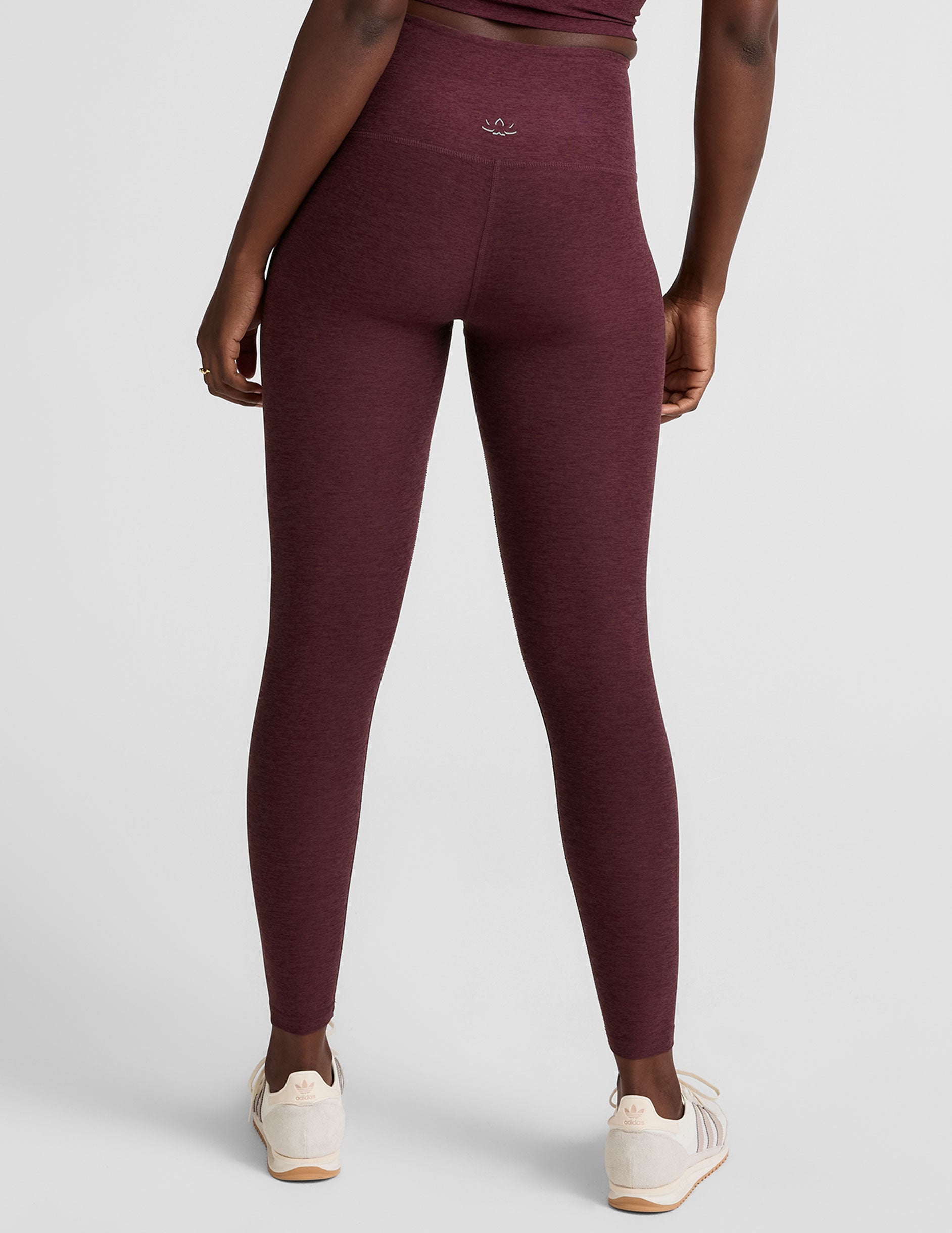 red high-waisted midi length leggings.