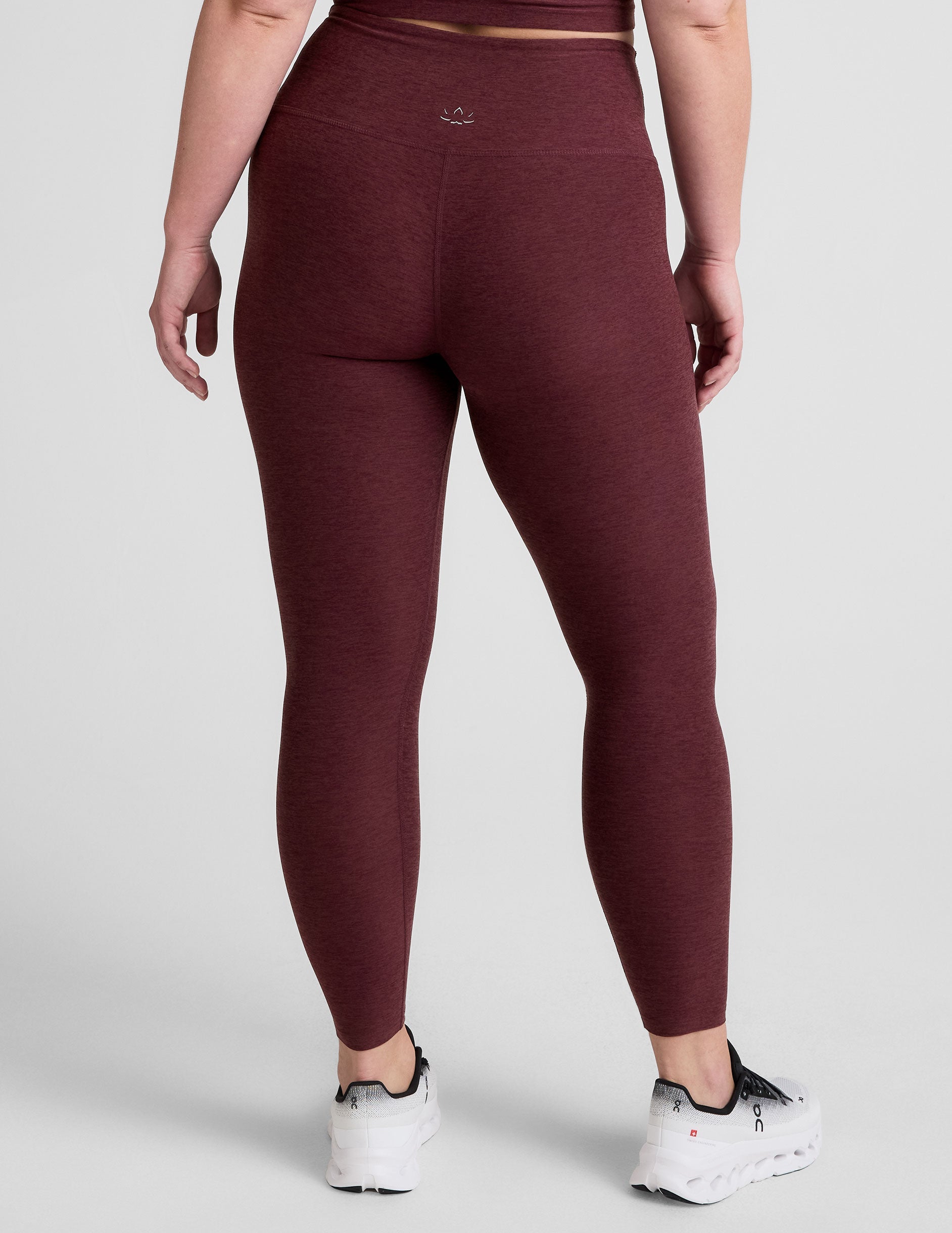 red high-waisted midi length leggings.