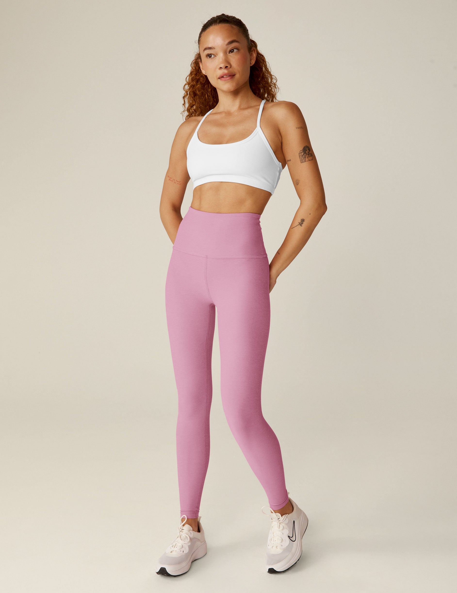 pink high-waisted midi leggings.