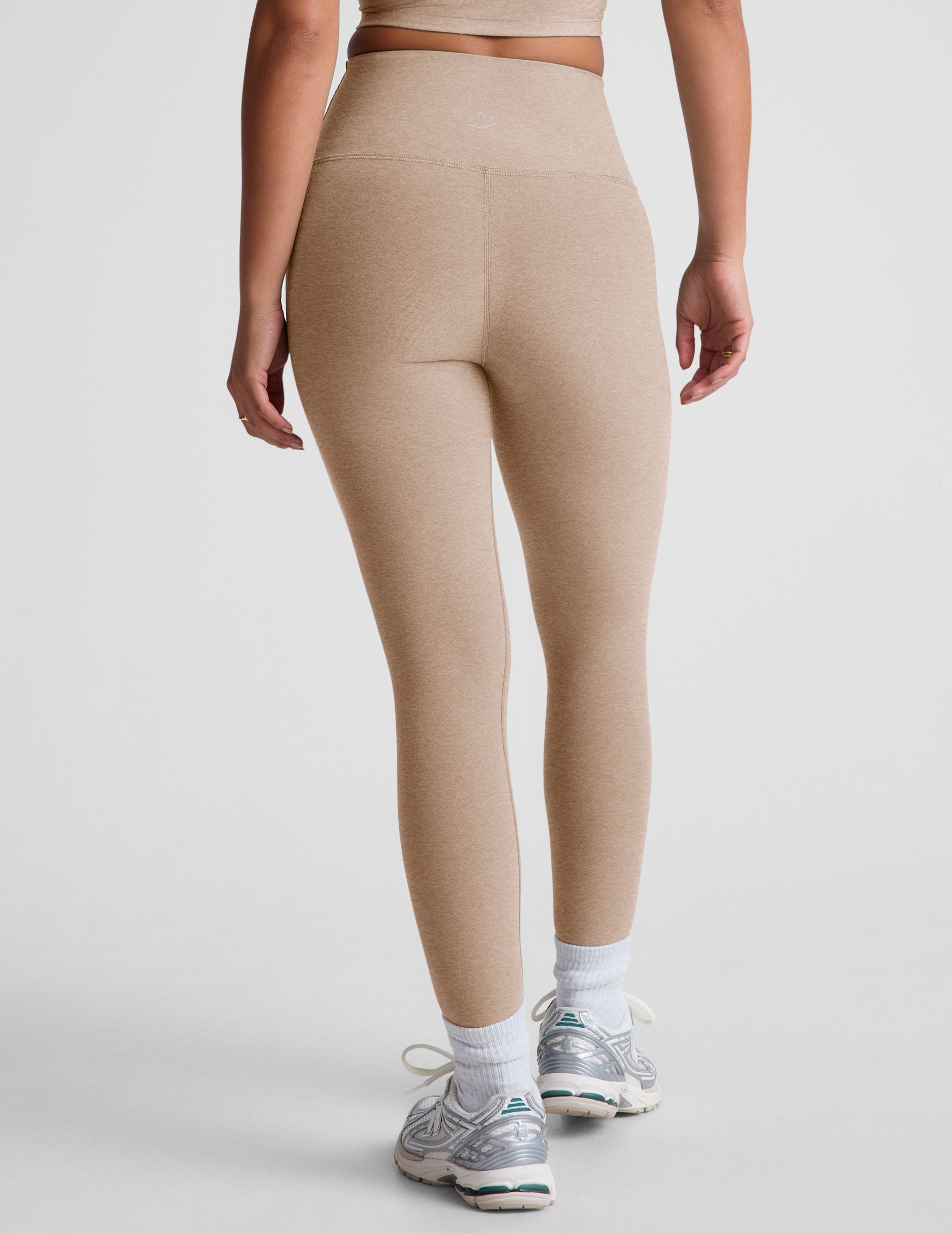 brown high-waisted midi length leggings.