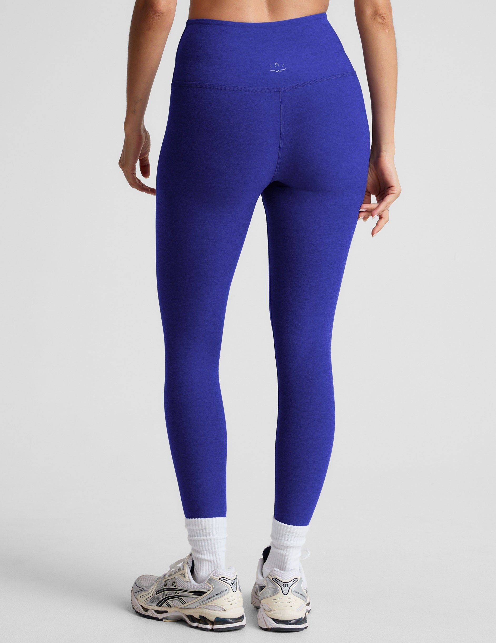 blue high-waisted midi length leggings.