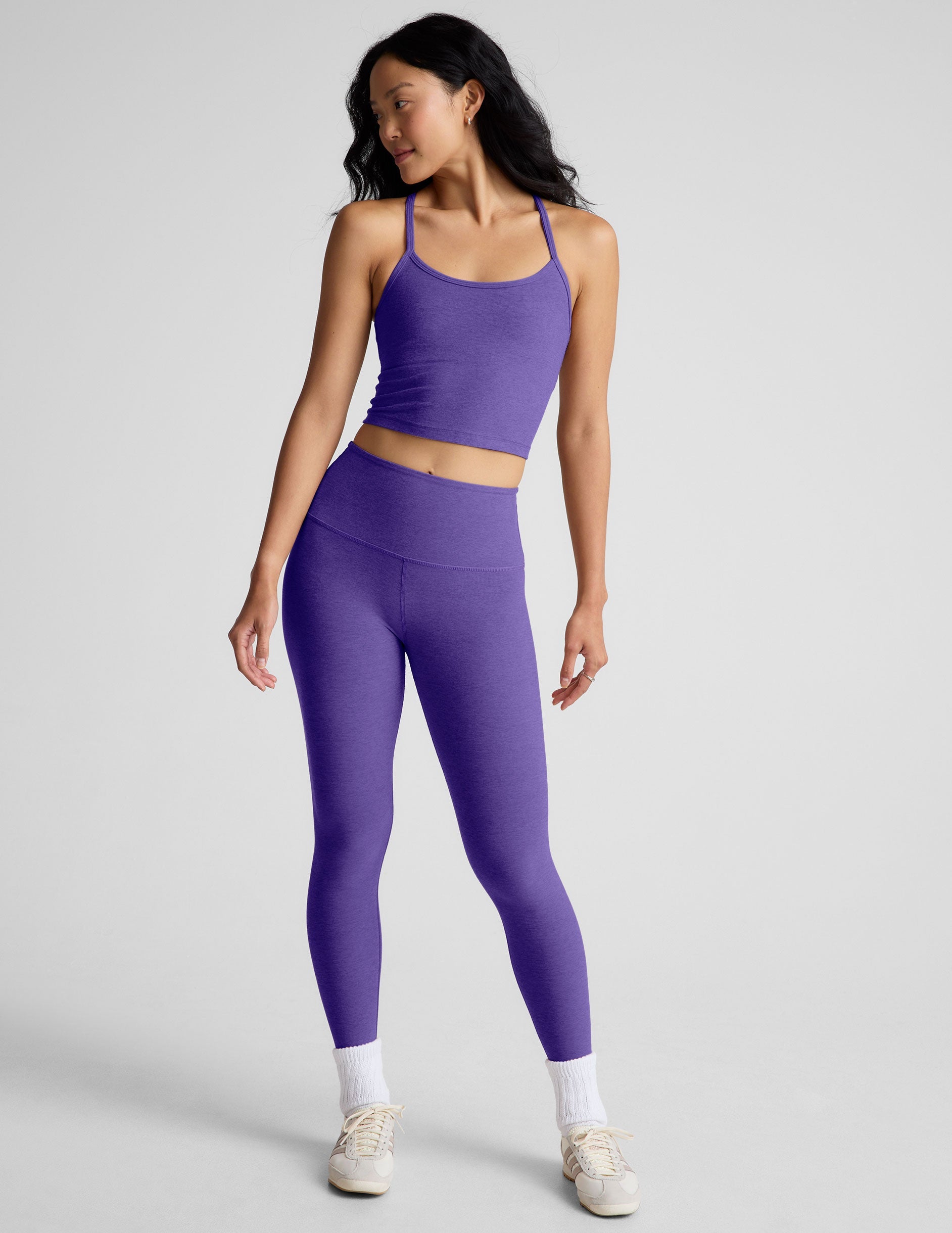 purple high-waisted midi length leggings.